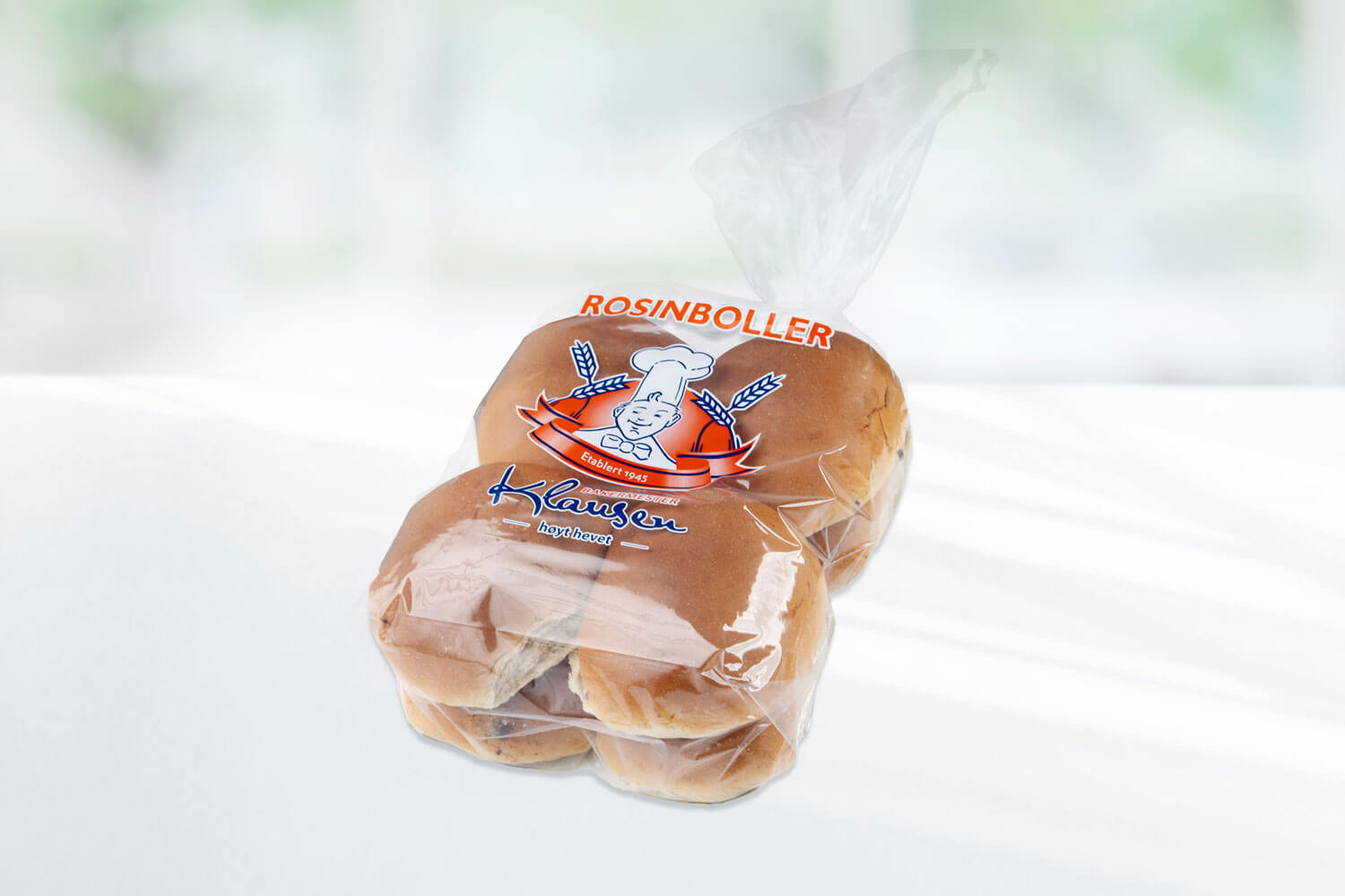 Pose med åtte rosinboller fra Baker Klausen